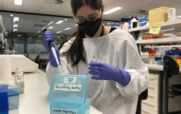 This image shows a laboratory technician at the University of NSW as part of the LEAF program